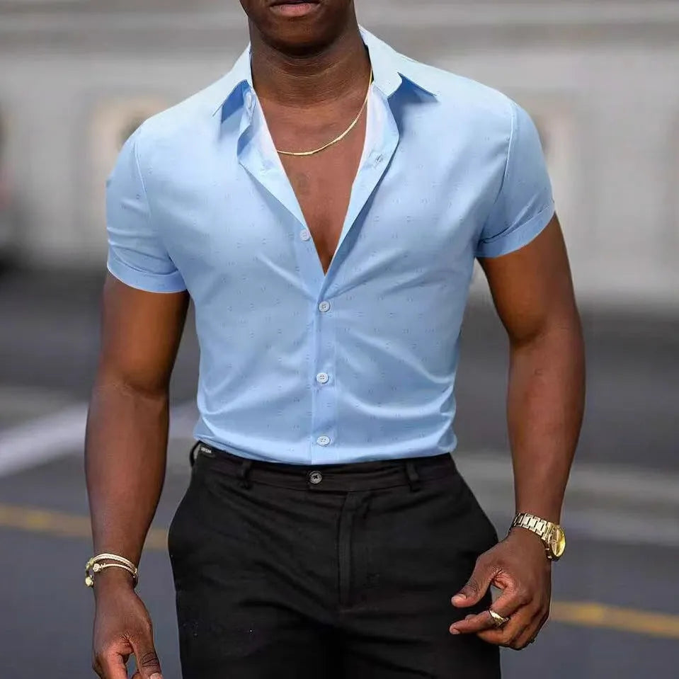 Man wearing a light blue short-sleeved shirt with an all-over floral print and a regular cardigan fit.