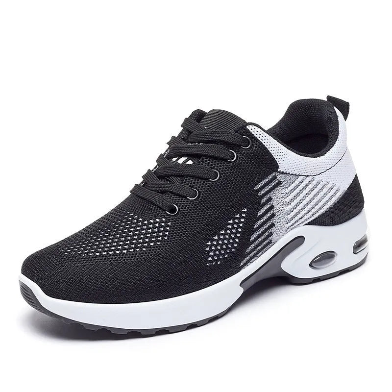 Women's Flyknit casual running shoes in striped pattern with lace-up front, shown in pink colour.
