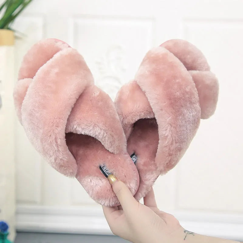 Cross open-toe fur slippers in various colours on a non-slip patterned rubber sole.