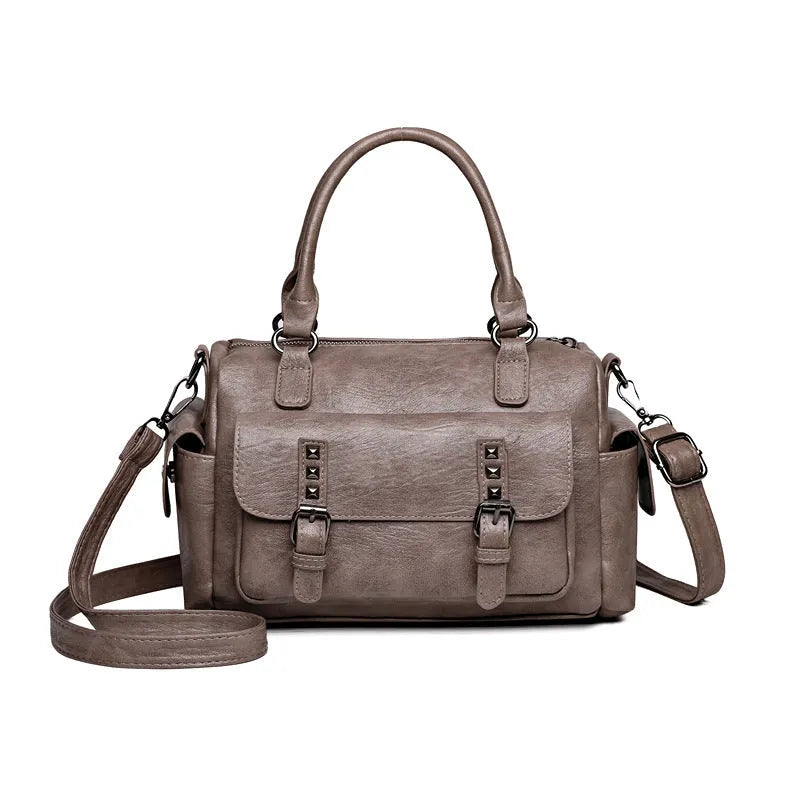 Vintage-style large messenger bag in PU leather, showing horizontal square shape and contrast stitching.