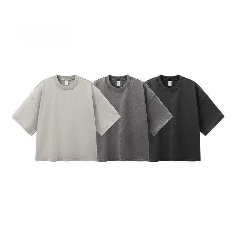 Men's cotton washed-out vintage t-shirt in khaki light showing drop-shoulder sleeve and loose fit
