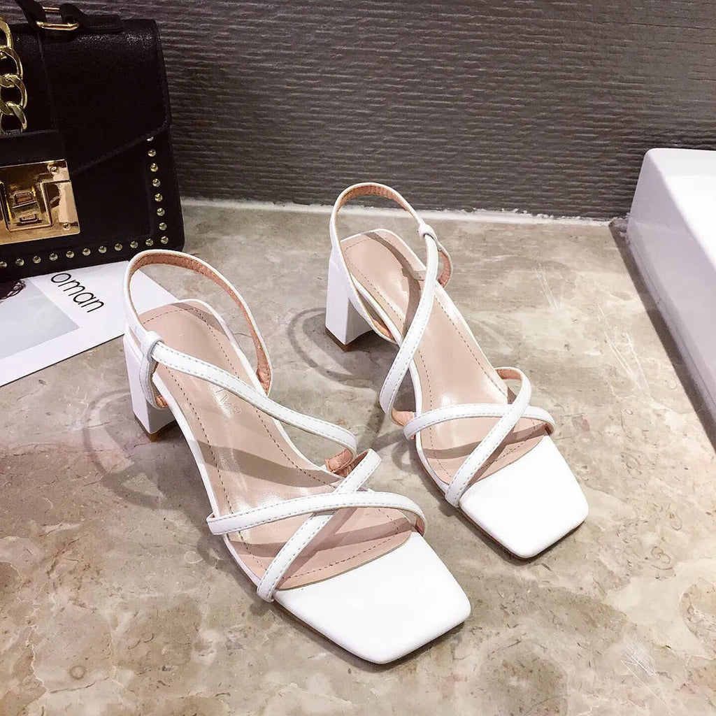Women's thick heel Roman sandals in apricot colour showing one-strap design and substantial heel