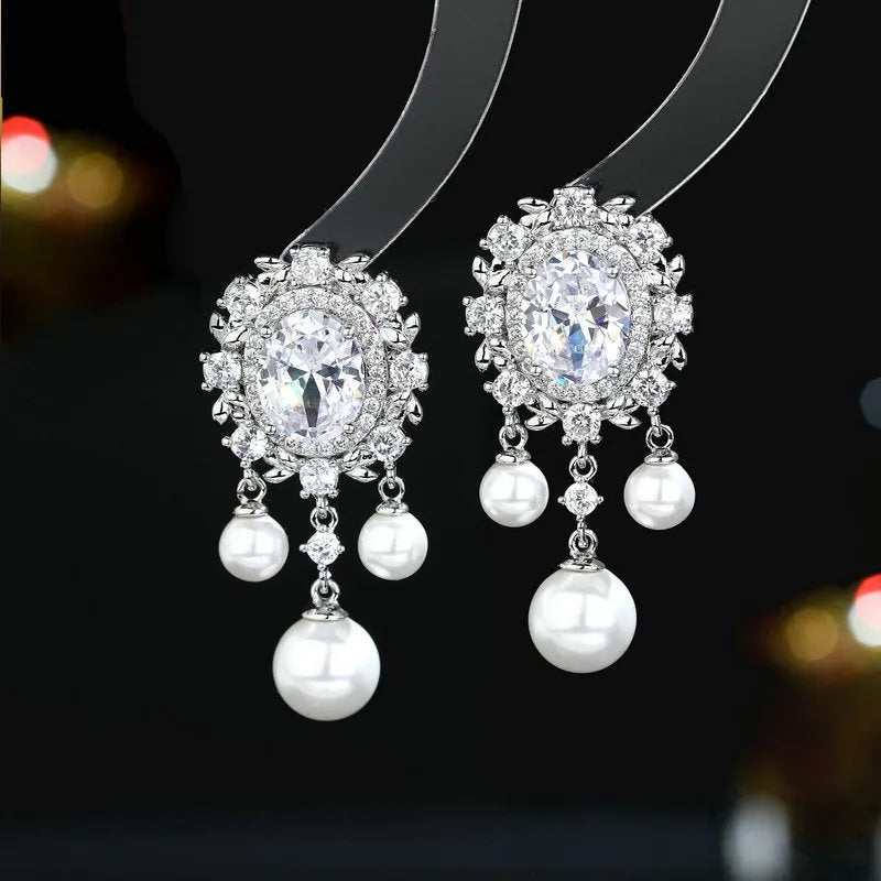 Geometric oval pearl tassel earrings with zircon detailing in light purple colour