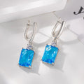 Square geometric copper earrings with electroplated gold finish showing quadrilateral design elements