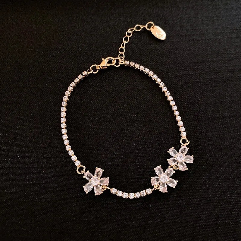 Gold-tone copper bracelet with geometric design and inlaid zircon stones for women