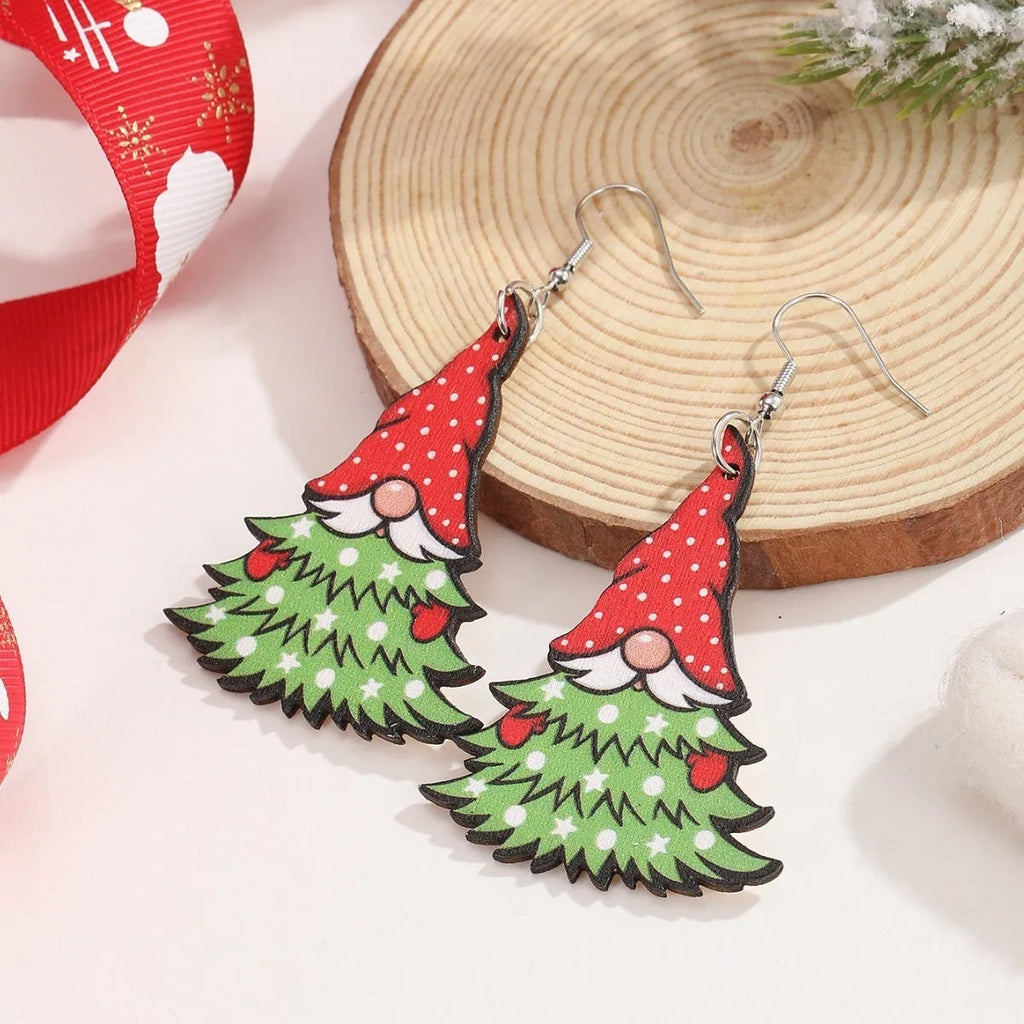 Wooden Christmas earrings with printed tree and snowman designs in geometric shapes