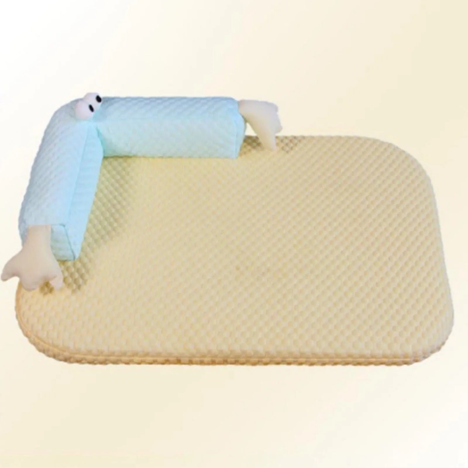 Blue pet bed cushion with cartoon monster face, showing non-slip base and folded size.