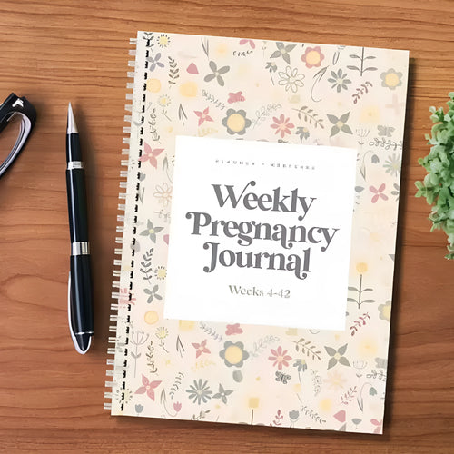 A5 sized weekly pregnancy diary notebook open on a page with the Pregnancy Weekly format