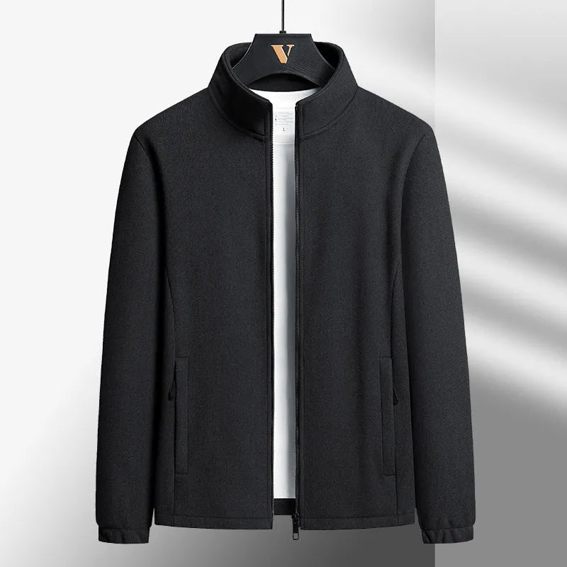 Man wearing a grey Berber fleece cardigan coat with a stand-up collar and zippered front.
