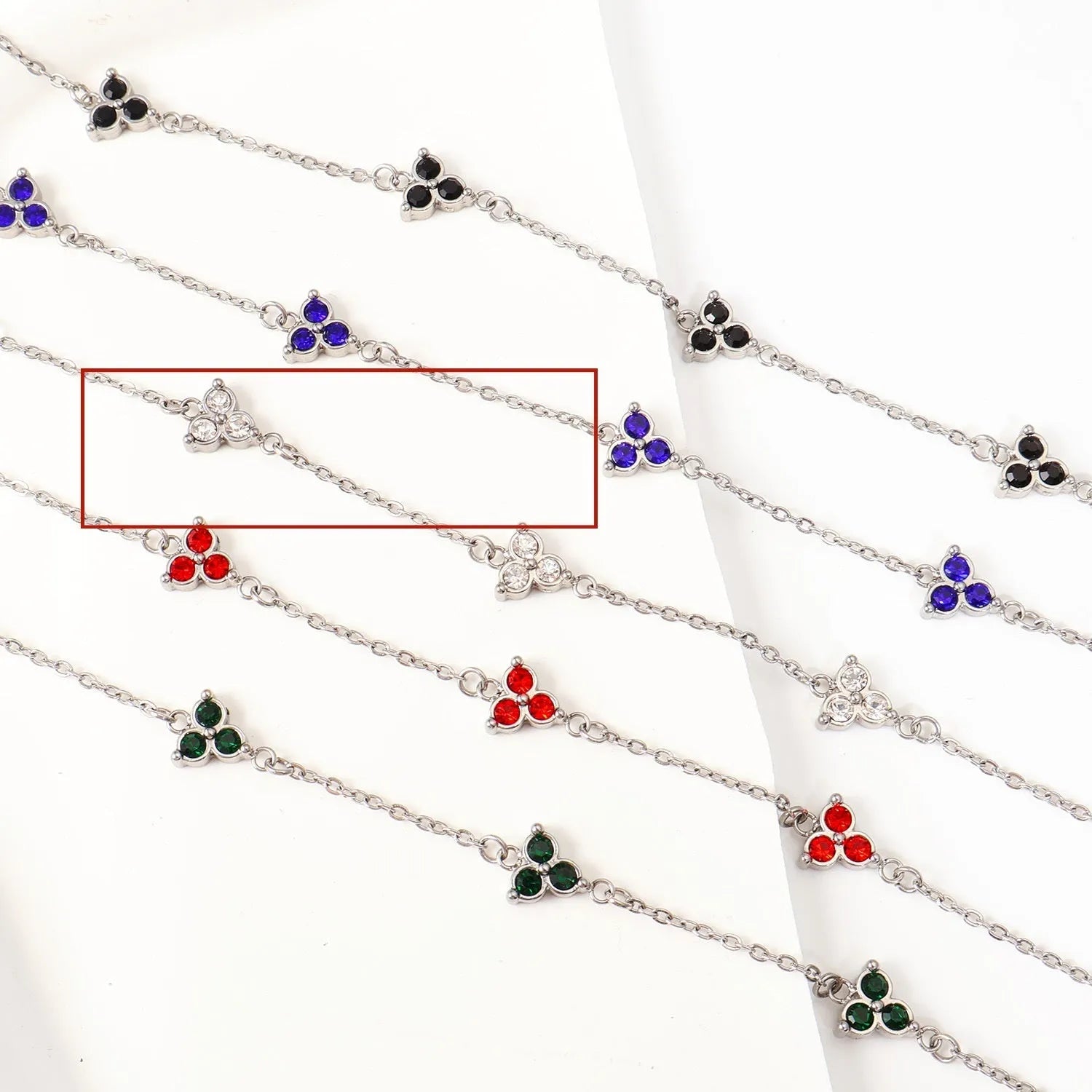 Geometric triangle women's bracelet in stainless steel with a choice of coloured centre stones on a gold or steel band.