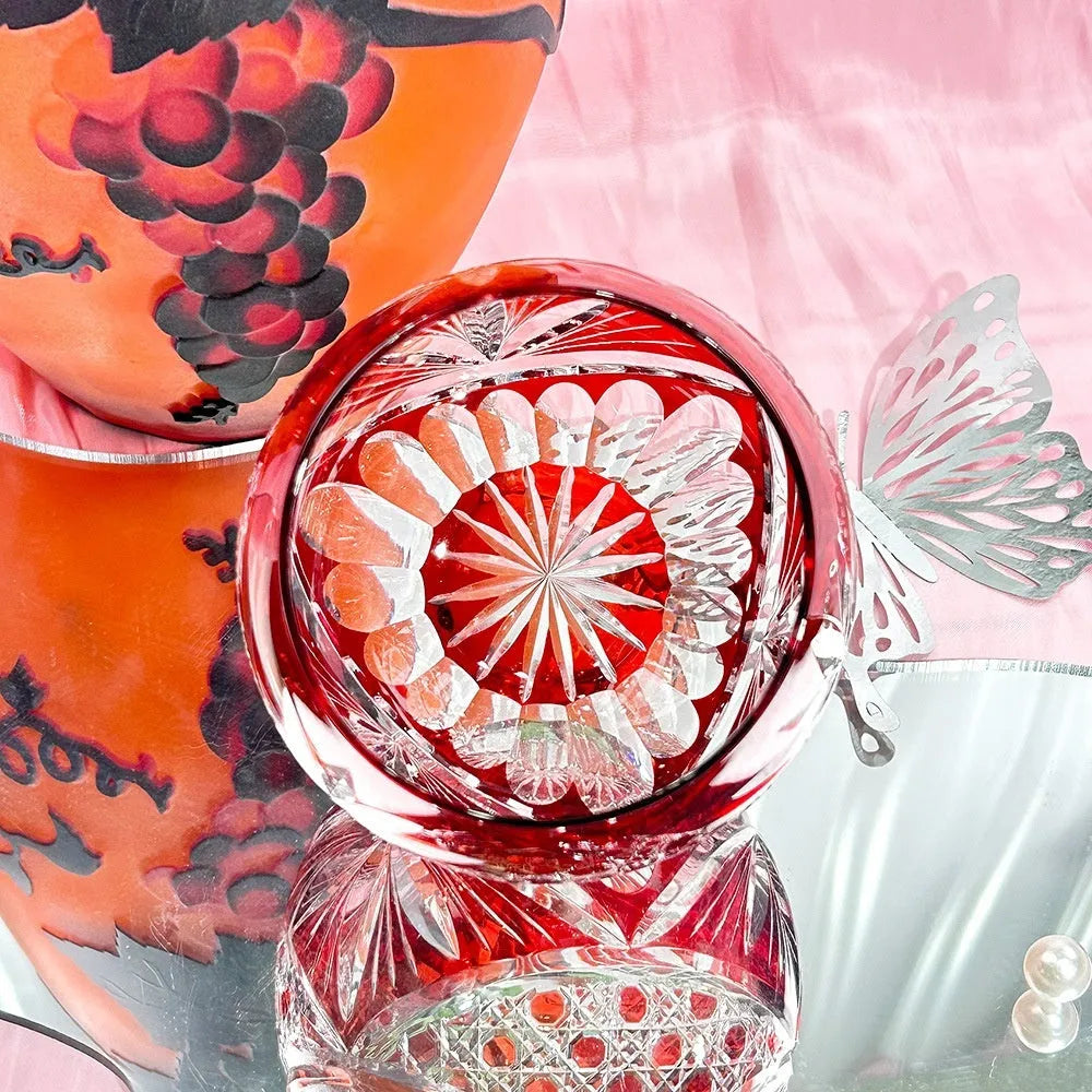 Crystal glass Jianghu Cut Zi Xinglu tumbler in violet with carved pattern on a bar surface