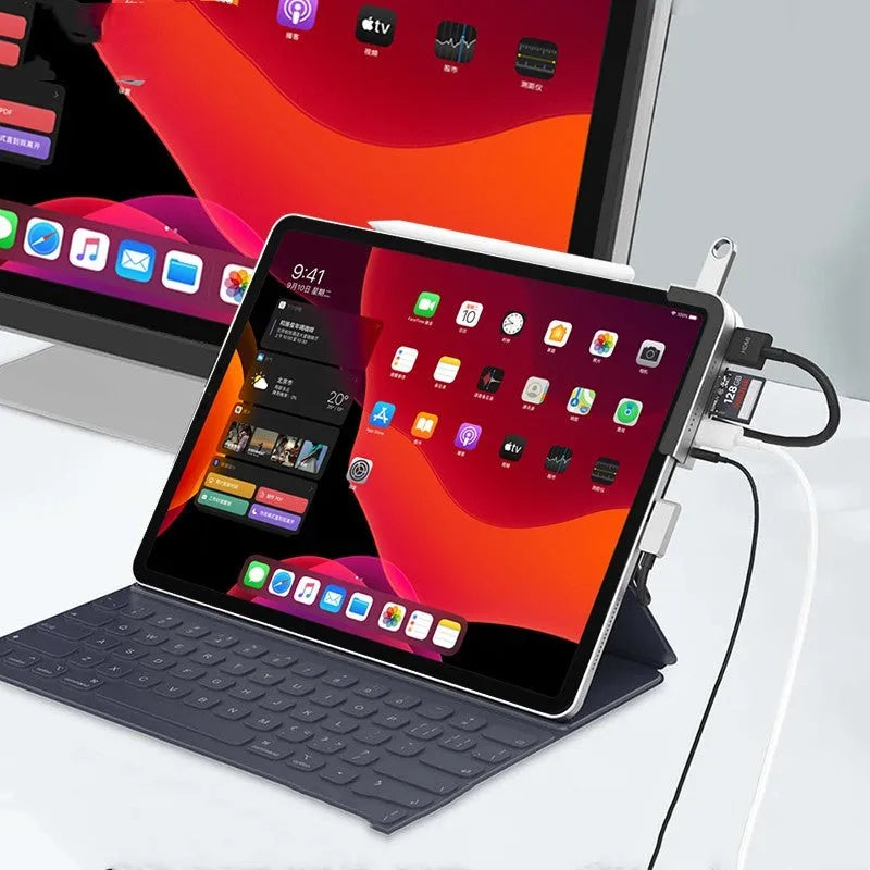 Silver aluminium grey 6-in-1 USB-C docking station for iPad Pro, showing HDMI and USB ports.