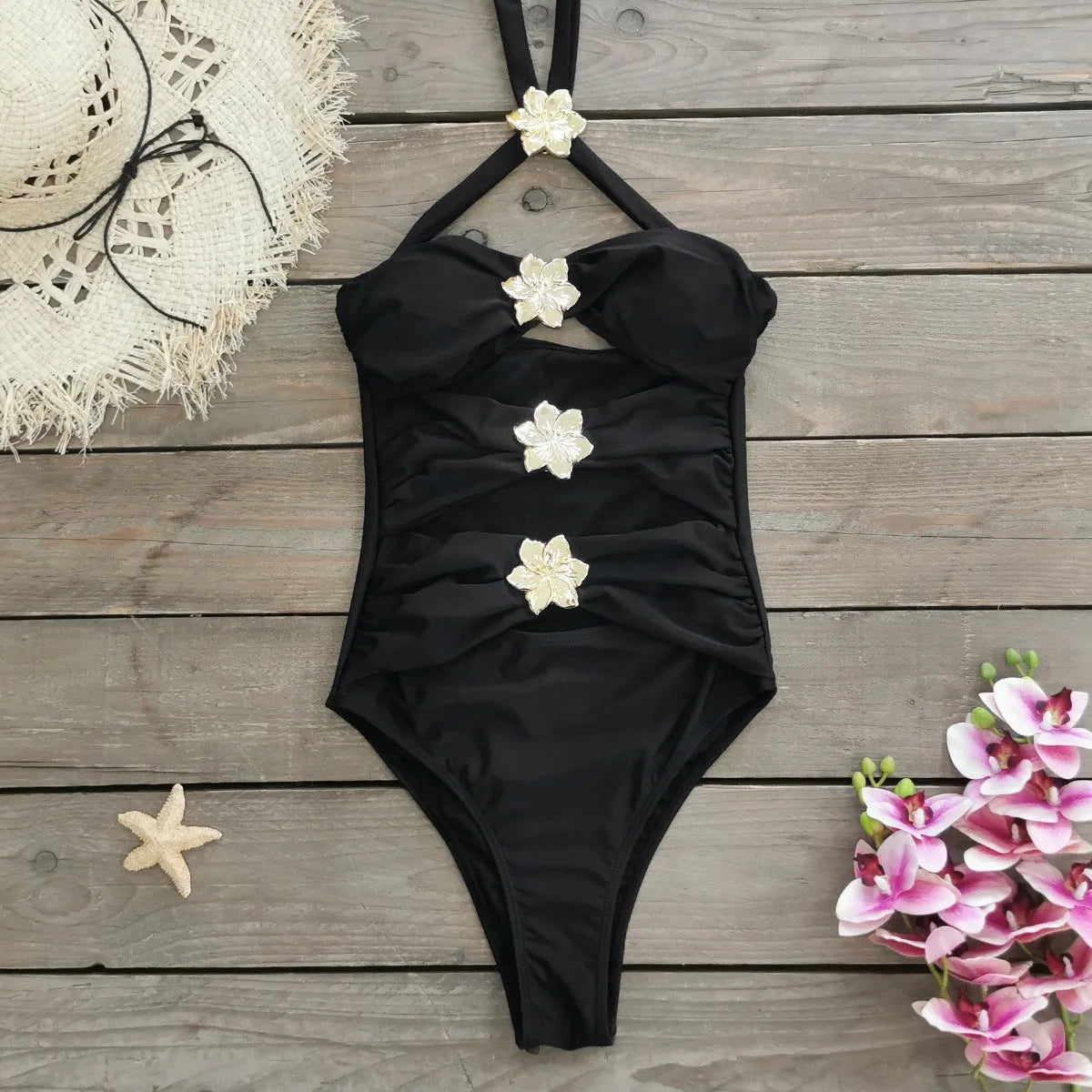 Women's solid colour one-piece swimsuit with a short skirt and hollow-out tube top design.