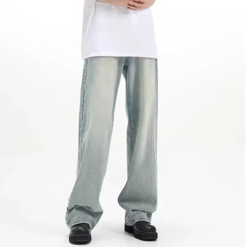 Blue loose-fit retro-style casual trousers with an elastic waistband on a hanger.