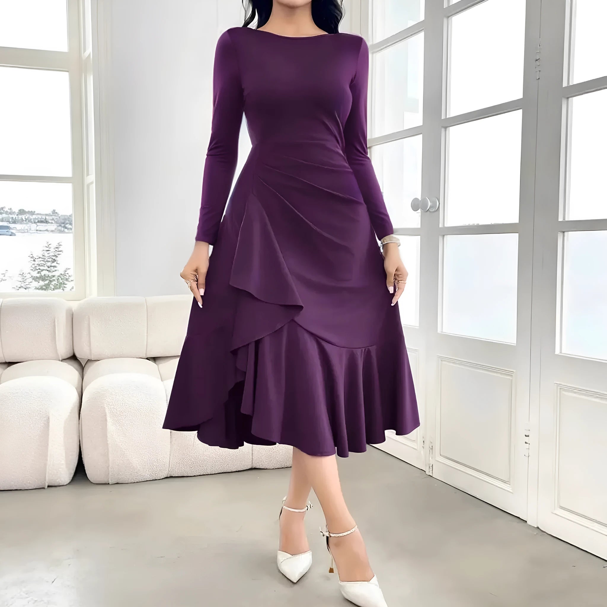 Purple women's long sleeve pullover dress with round neck and ruffle detail on a hanger.