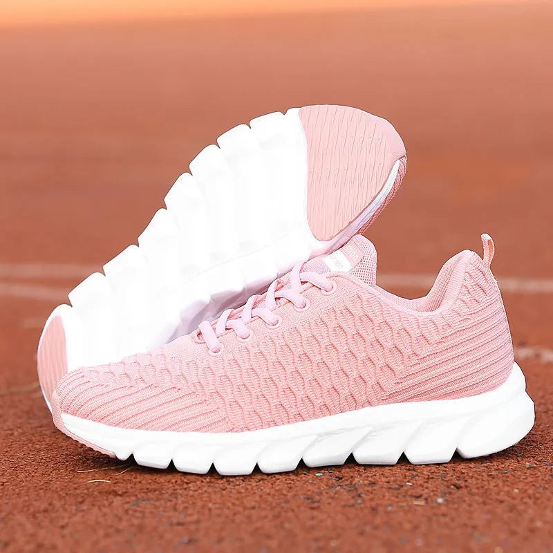 Women's running shoes with fly weaving upper in black, pink, or white colours.