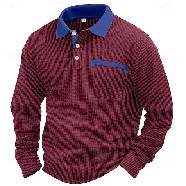 Man wearing a long-sleeve waffle-texture polo shirt in a loose retro fit, showing asymmetric design detail.