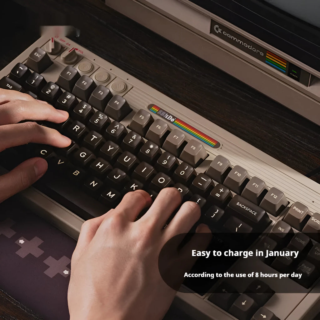 Retro87 C64 wireless Bluetooth mechanical keyboard with rocker on a desk.