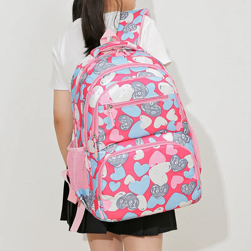 Blue children's school backpack with air pillow shoulder belts and large capacity storage compartments