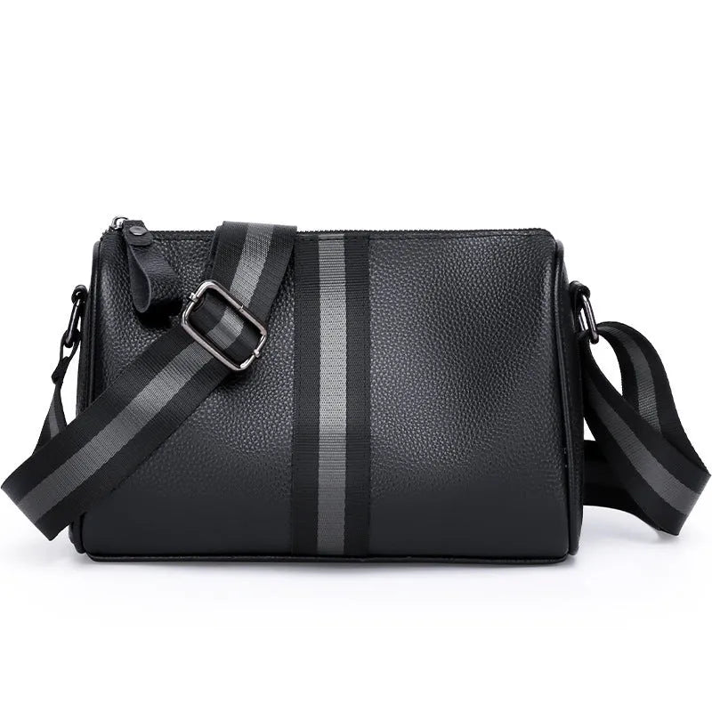 Black genuine leather crossbody bag with adjustable strap and large 24x16x13cm capacity.