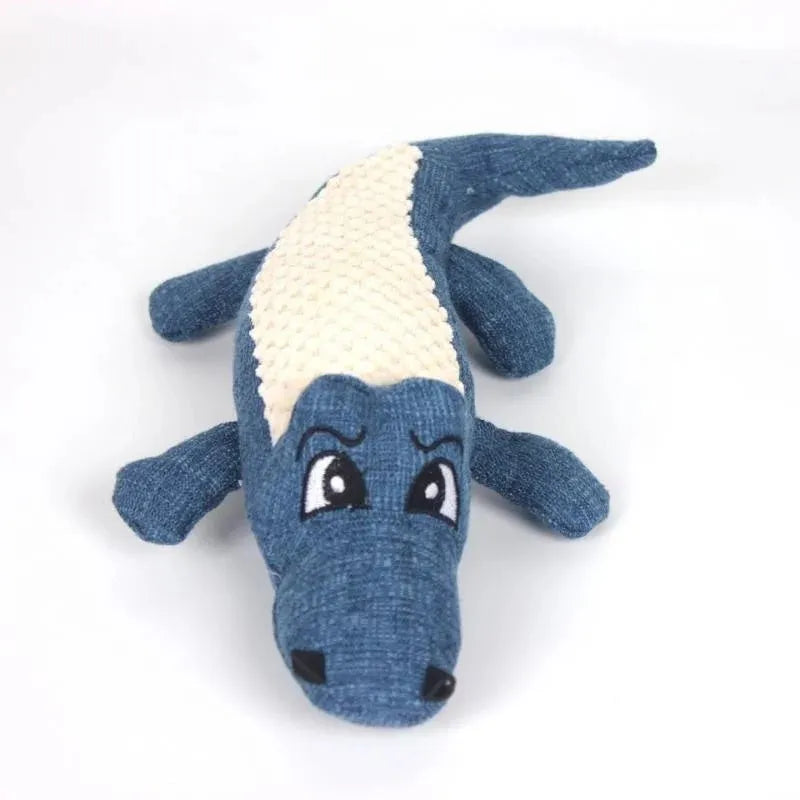 Blue, green, and red plush pet toys with corn grid texture and biting sound feature