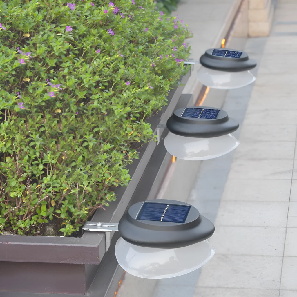 Black and white versions of a solar-powered Southeast Asian style outdoor wall lamp with 9 LEDs.