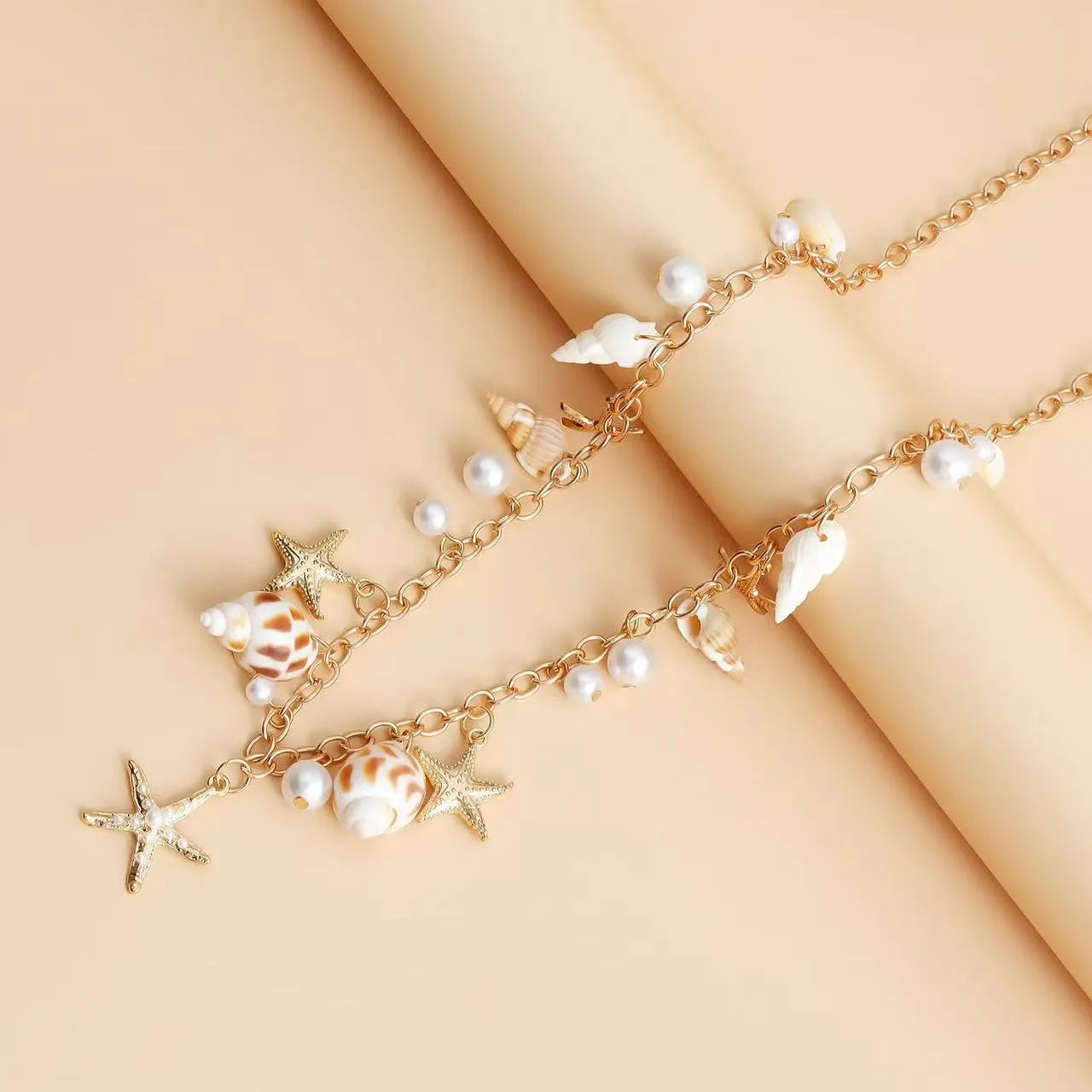 Women's star-shaped waist chain and matching bracelet set for summer beach outfits