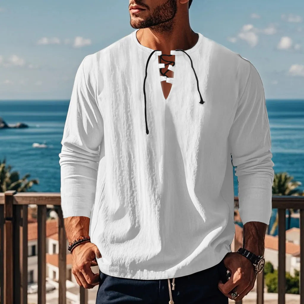 A man wearing a loose-fit solid colour cotton linen blend casual shirt.