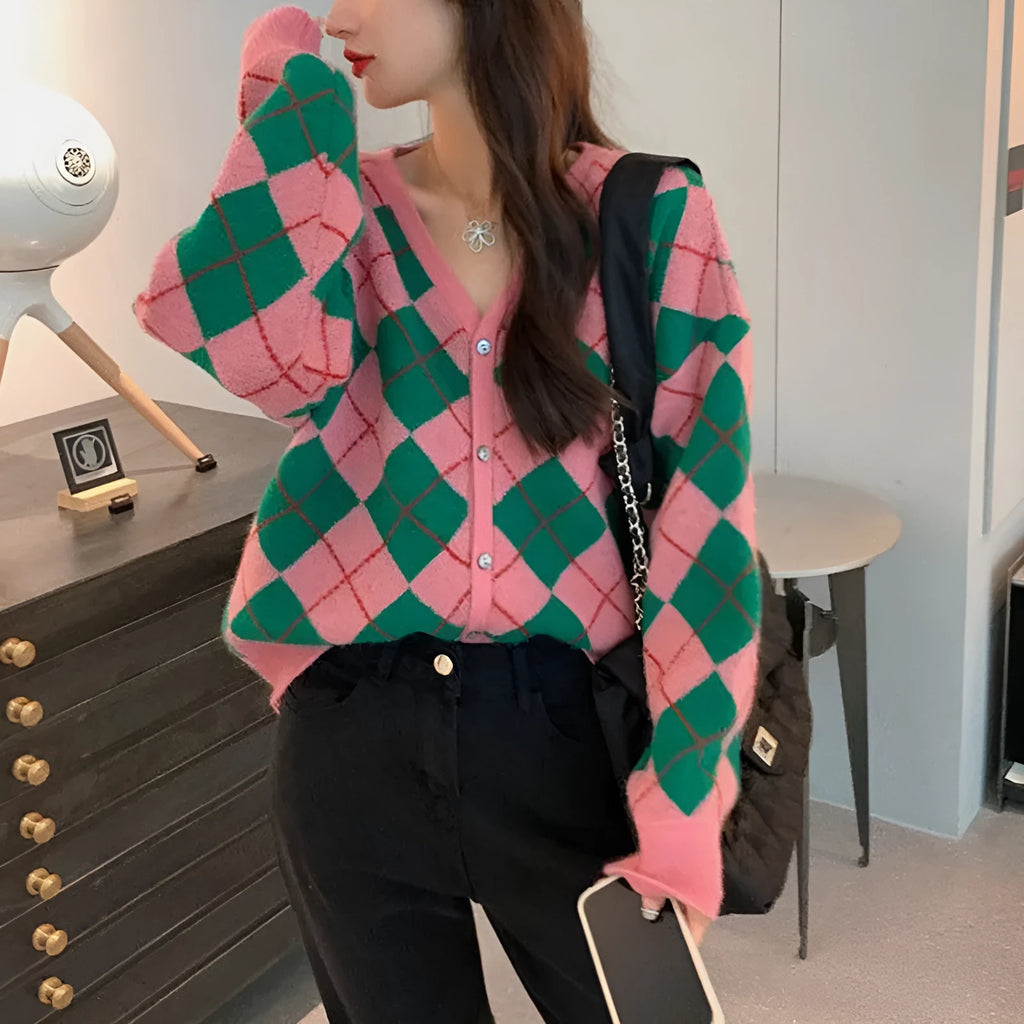 Casual pink knitted cardigan coat with regular sleeves, shown on a hanger.