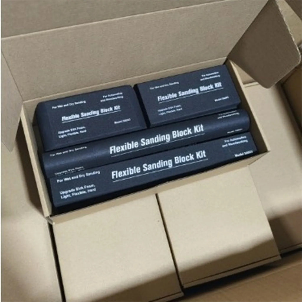 Seven black frosted EVA building blocks with metal connectors on a white surface.
