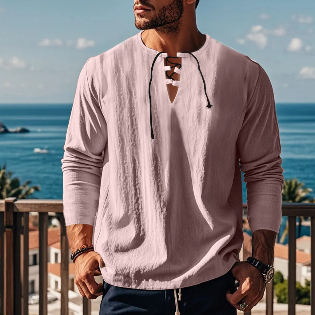 A man wearing a loose-fit solid colour cotton linen blend casual shirt.