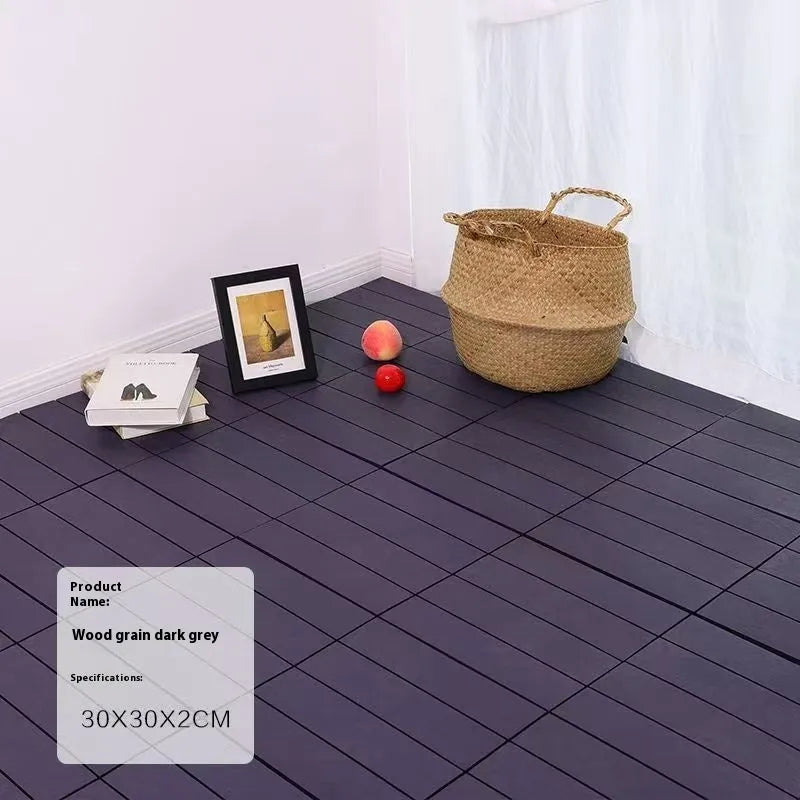 Pack of ten wood grain plastic interlocking floor tiles showing splicing edges.
