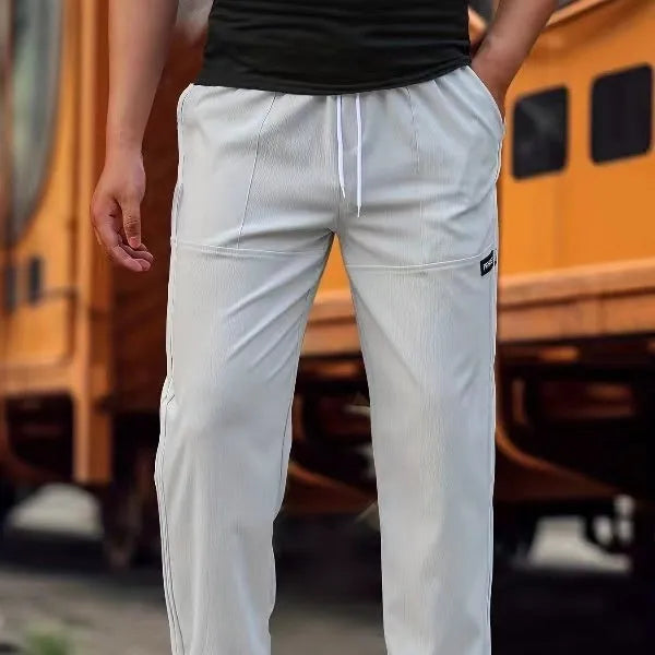 Men's polyester trousers for spring and autumn available in multiple colours and sizes