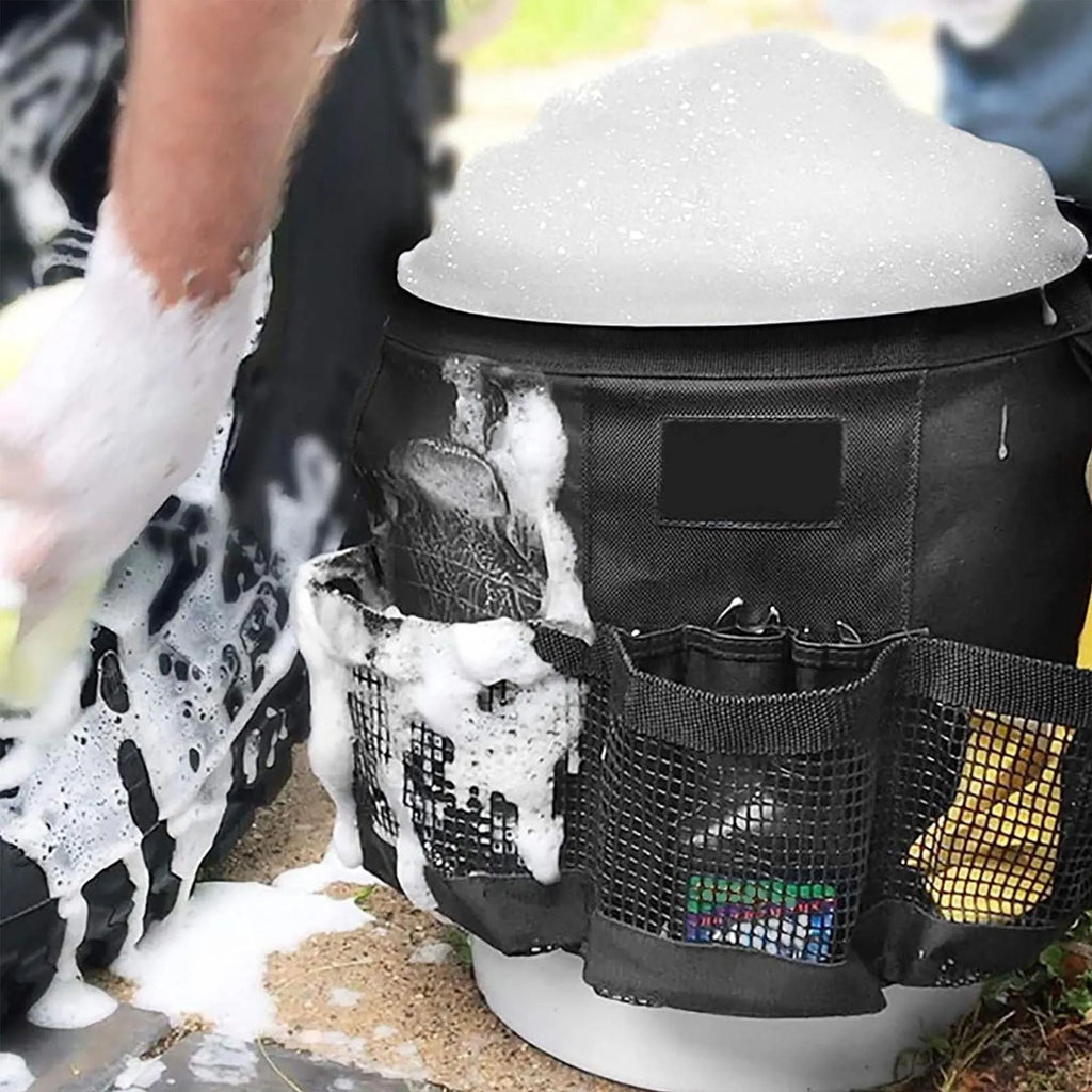 Black cylindrical polyester hanging storage bag shown fitted on a 5 gallon barrel.