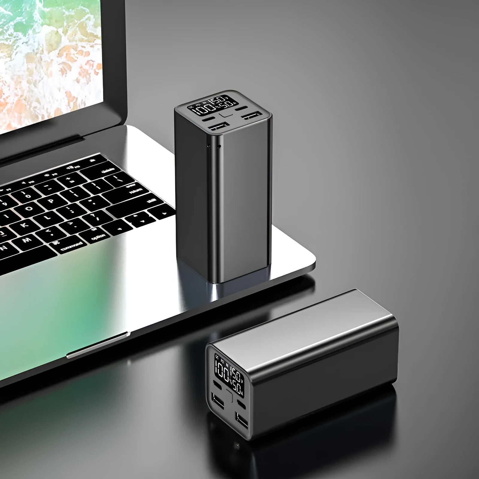 Black metal 65W laptop power bank with 20000mAh capacity showing USB ports