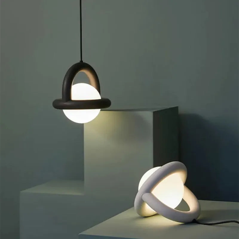 Danish designer hanging line lamp in a Nordic style for bedside or living room use.