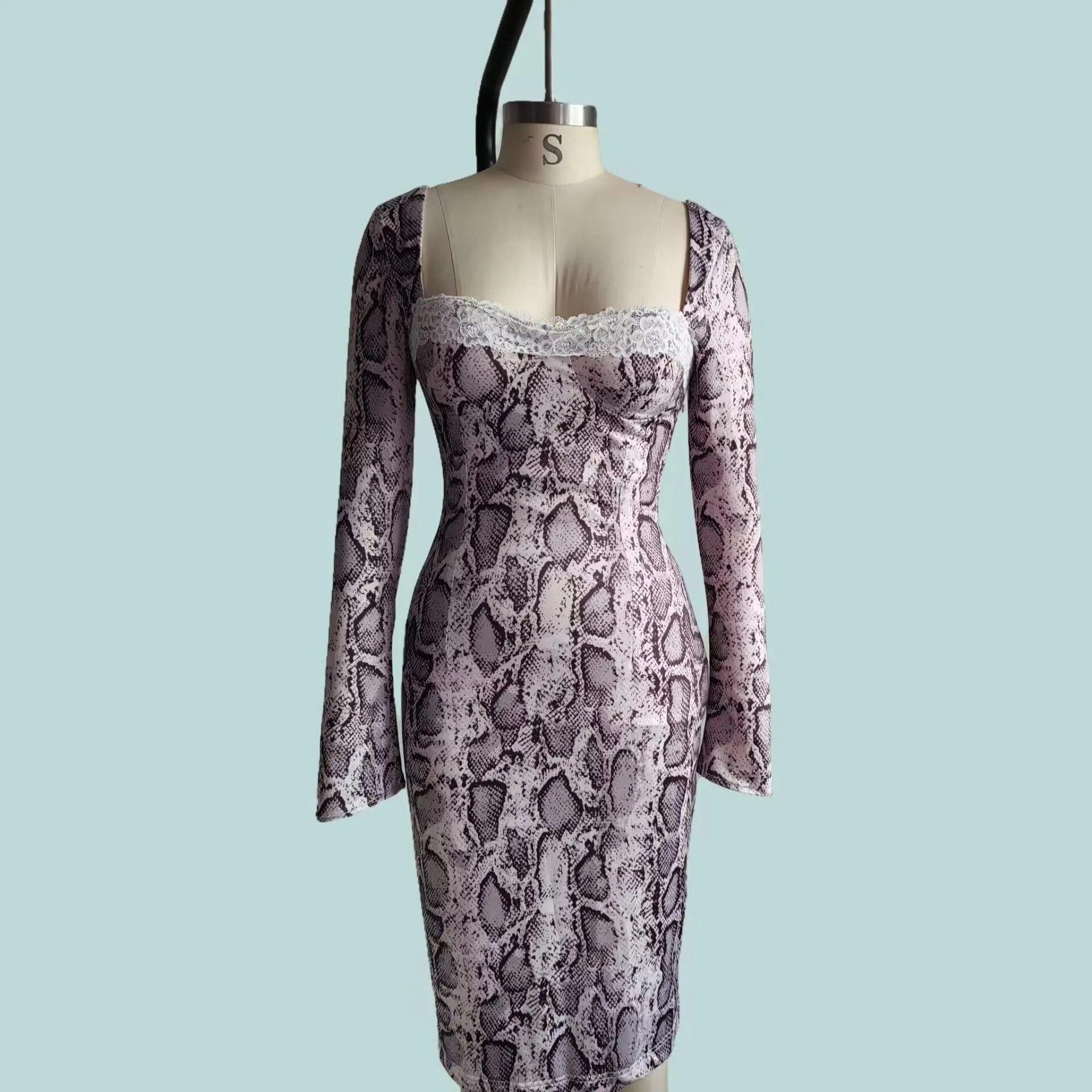 Grey slim-fit A-line dress with digital 3D print pattern and lace detailing, long sleeves.