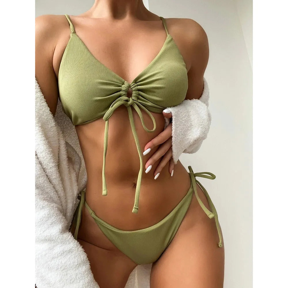 Women's solid colour drawstring bikini swimsuit in quick-dry nylon on a mannequin.