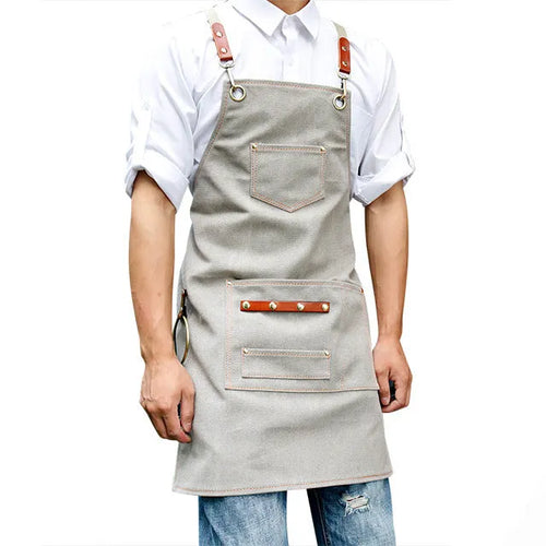 Canvas apron with cross back straps in camel colour for cafe and baking workwear