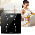 Black electronic bathroom scale with digital display showing weight measurement up to 180kg