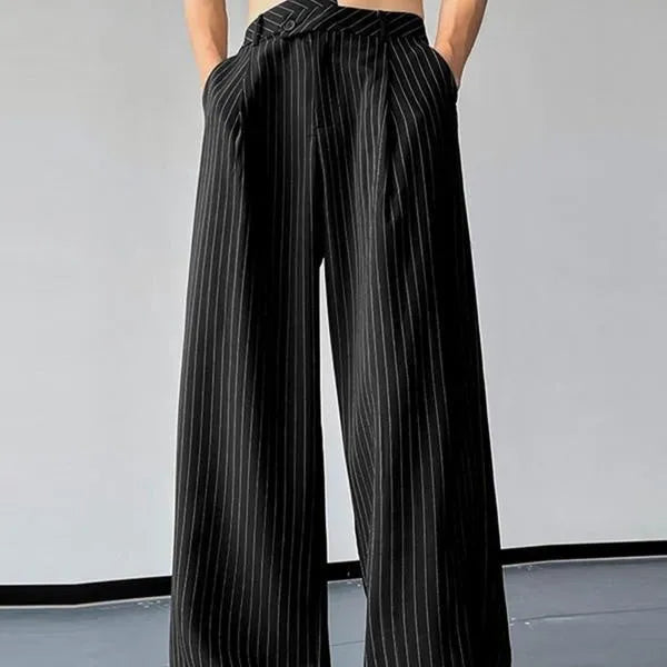 Black men's trousers with vertical stripes and pleats, made from an elastic rabbit hair and bamboo fibre blend.