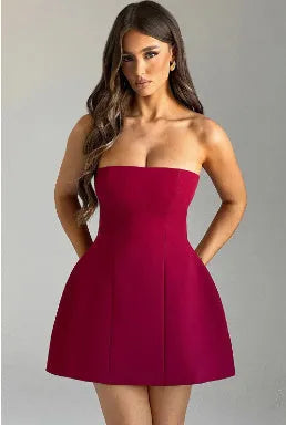 Backless slim-fit tube dress with A-line skirt in solid colour options.