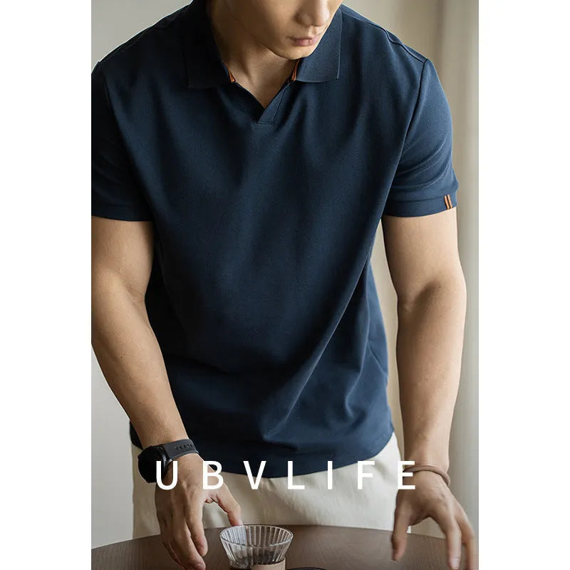 American-style short-sleeve polo shirt in blue, black, or white cotton-polyester blend.