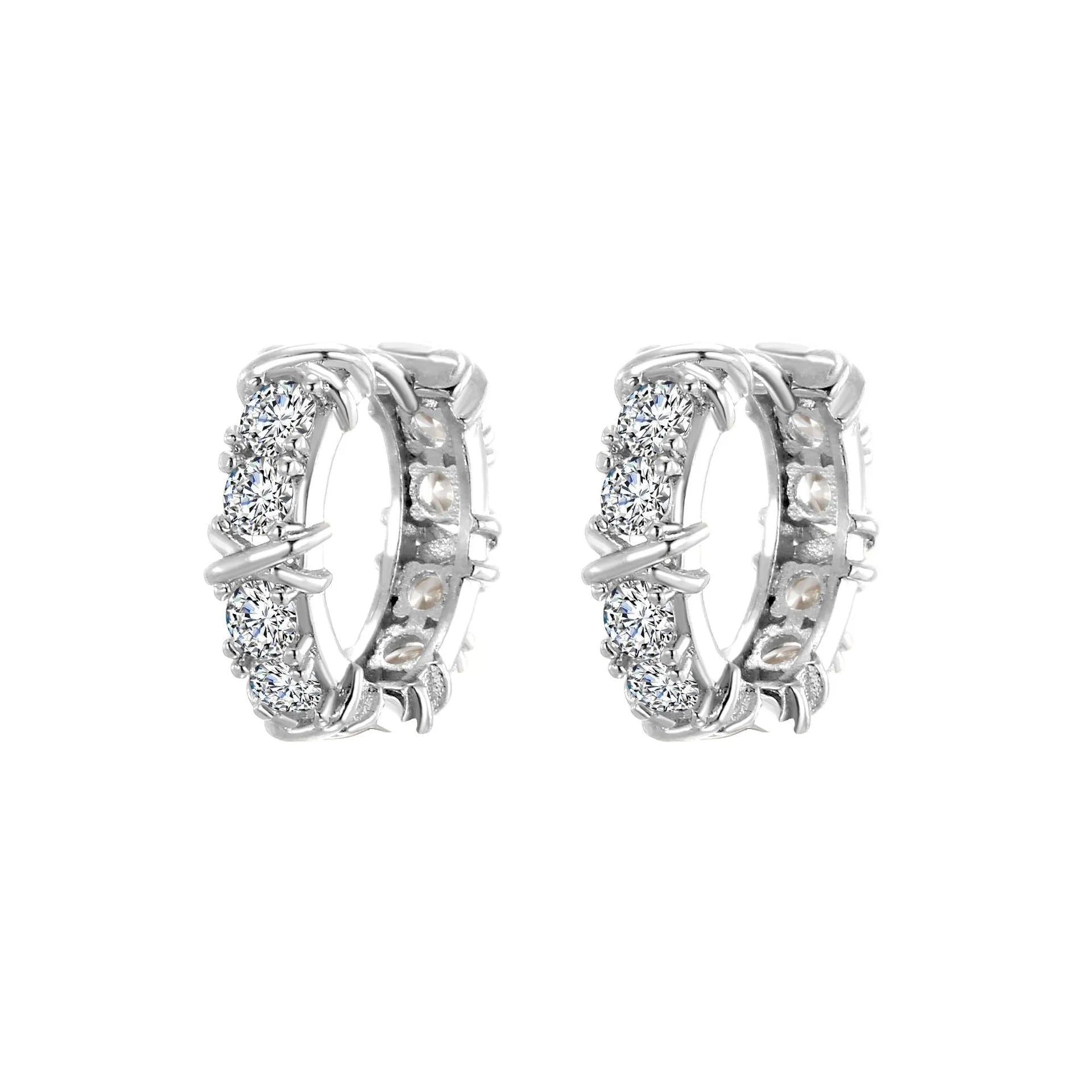 A pair of geometric clover cross earrings with a hexagonal shape in a silver or gold electroplated finish.