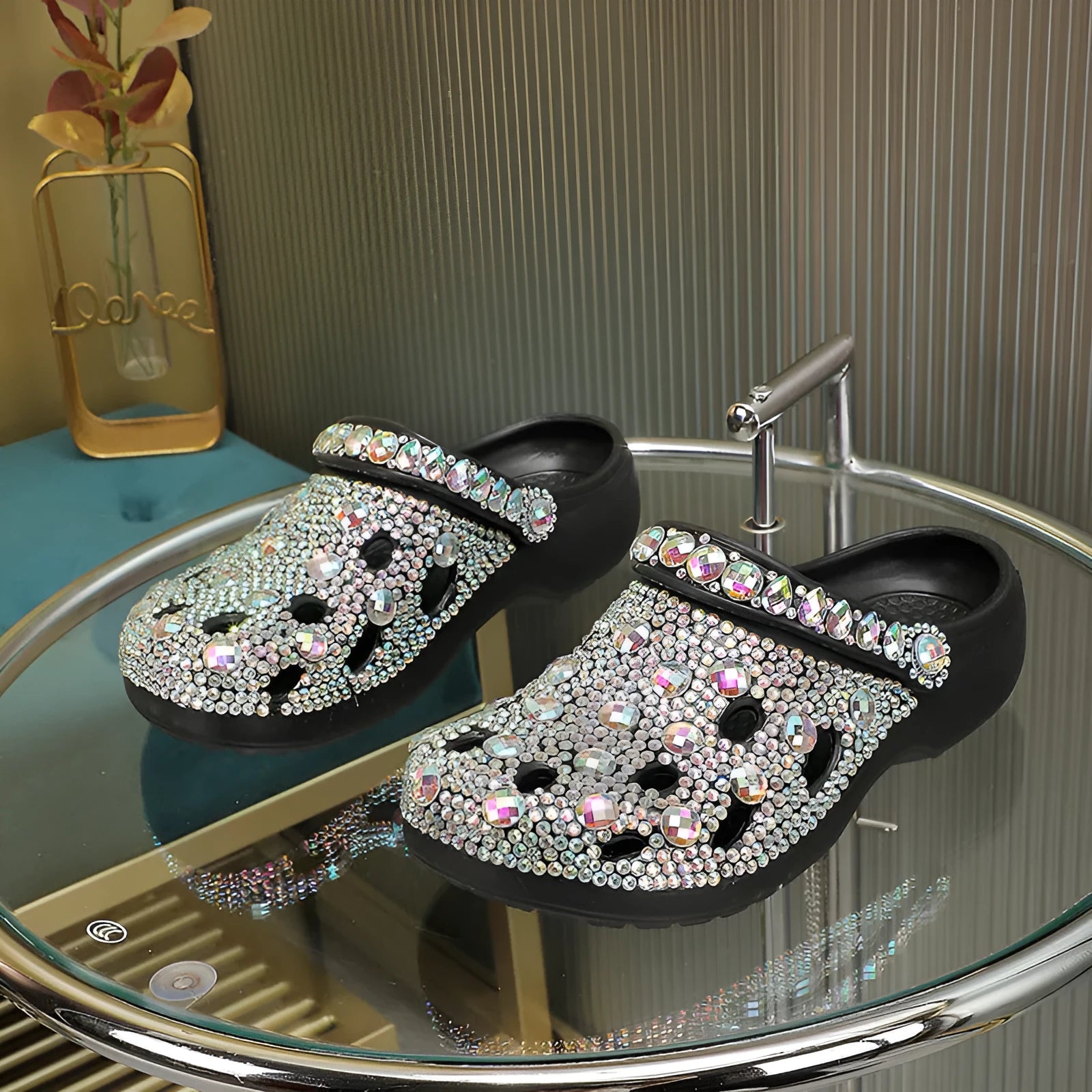 Black women's platform sandals with a hole design and rhinestone details on a lightweight EVA sole.