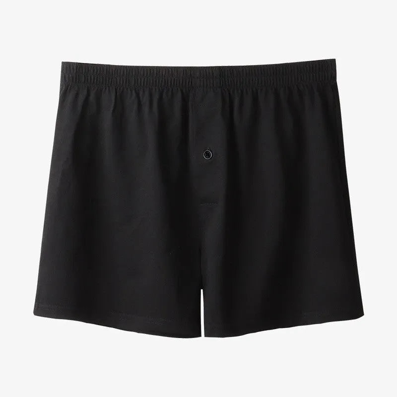 Men's high-waisted loose-fit cotton boxer shorts in black, grey, and navy blue.