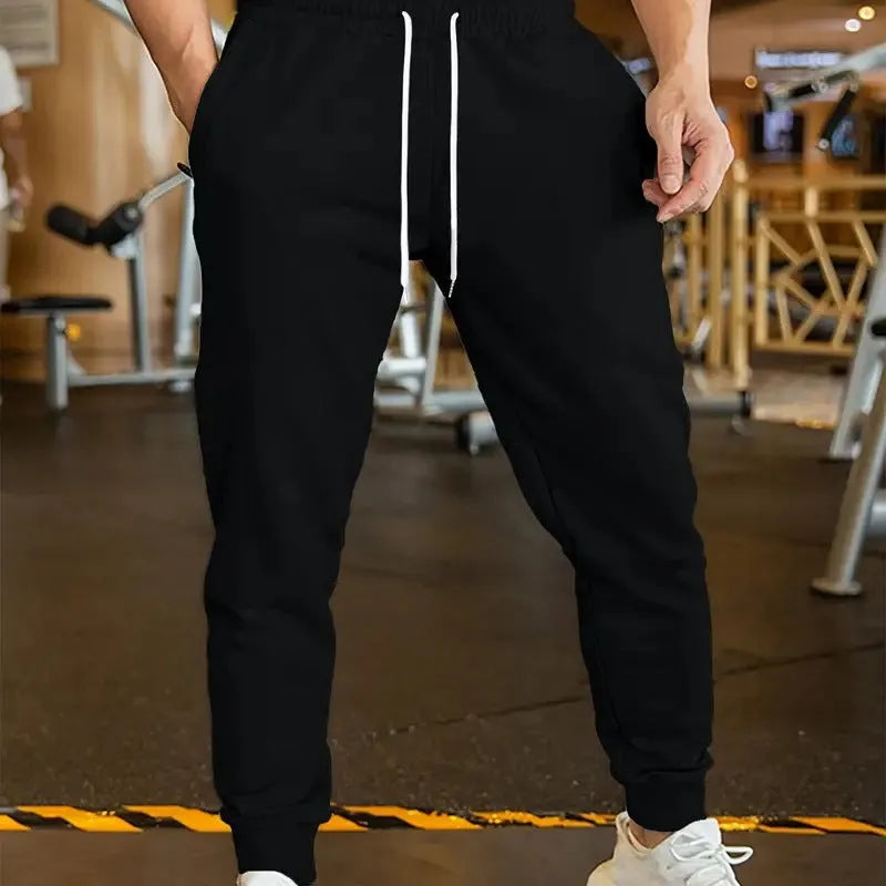 Men's linen-style leisure trousers with elastic drawstring waistband and loose fit design