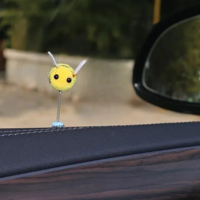 Swing spring bee car decoration made from a fur ball, measuring 3cm by 3cm.