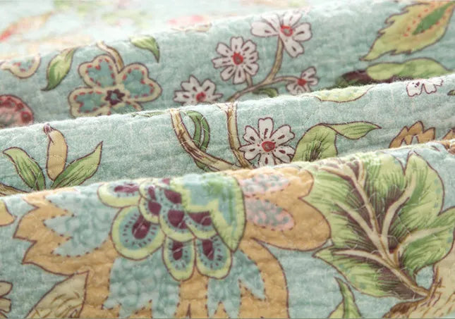 Blue floral patterned cotton bed sheet set with American bedspread styling and quilting design