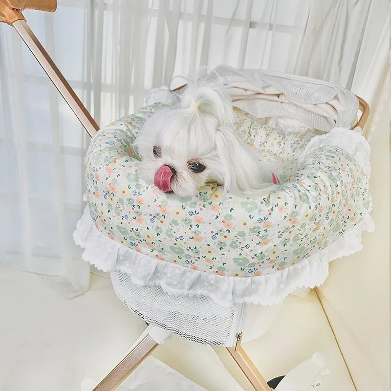 Pet stroller three-piece cushion set with removable cloth towel, pillow and pad in floral pattern.